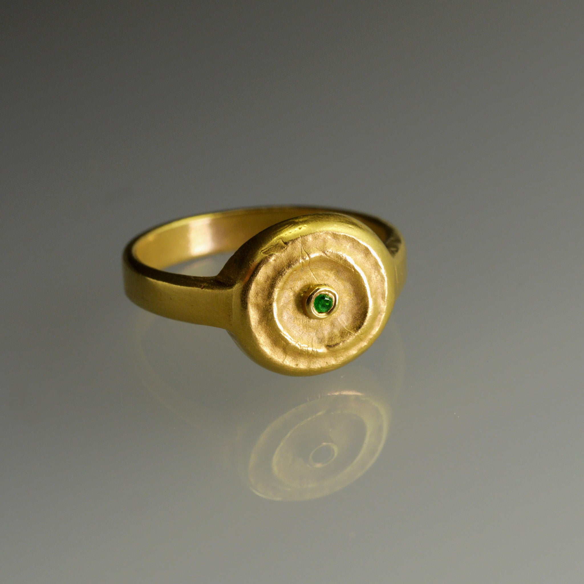 Handmade 18k Gold ring with a central Emerald, exuding vintage charm reminiscent of the Egyptian pharaohs' era.