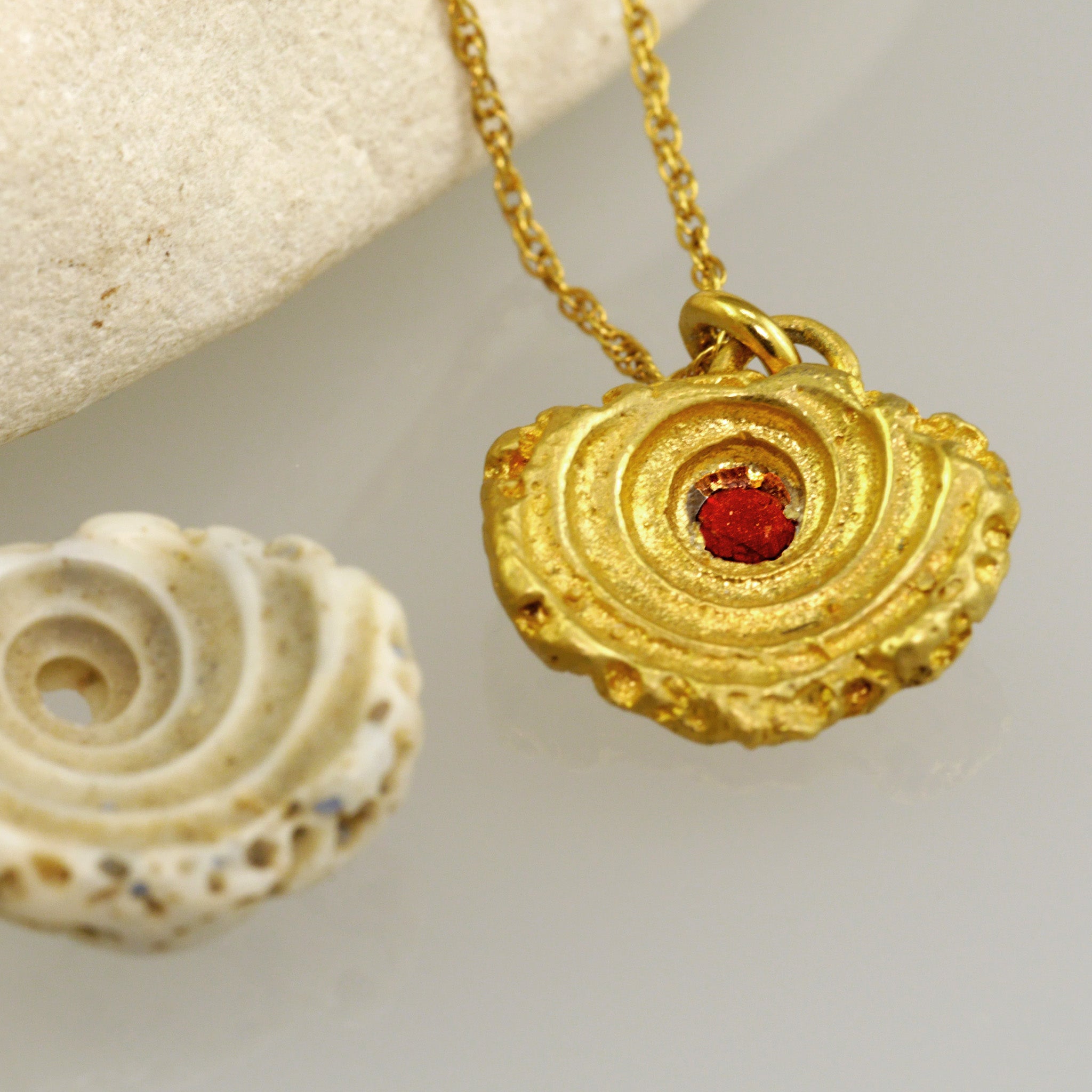 Yellow Gold Seashell pendant with Ruby