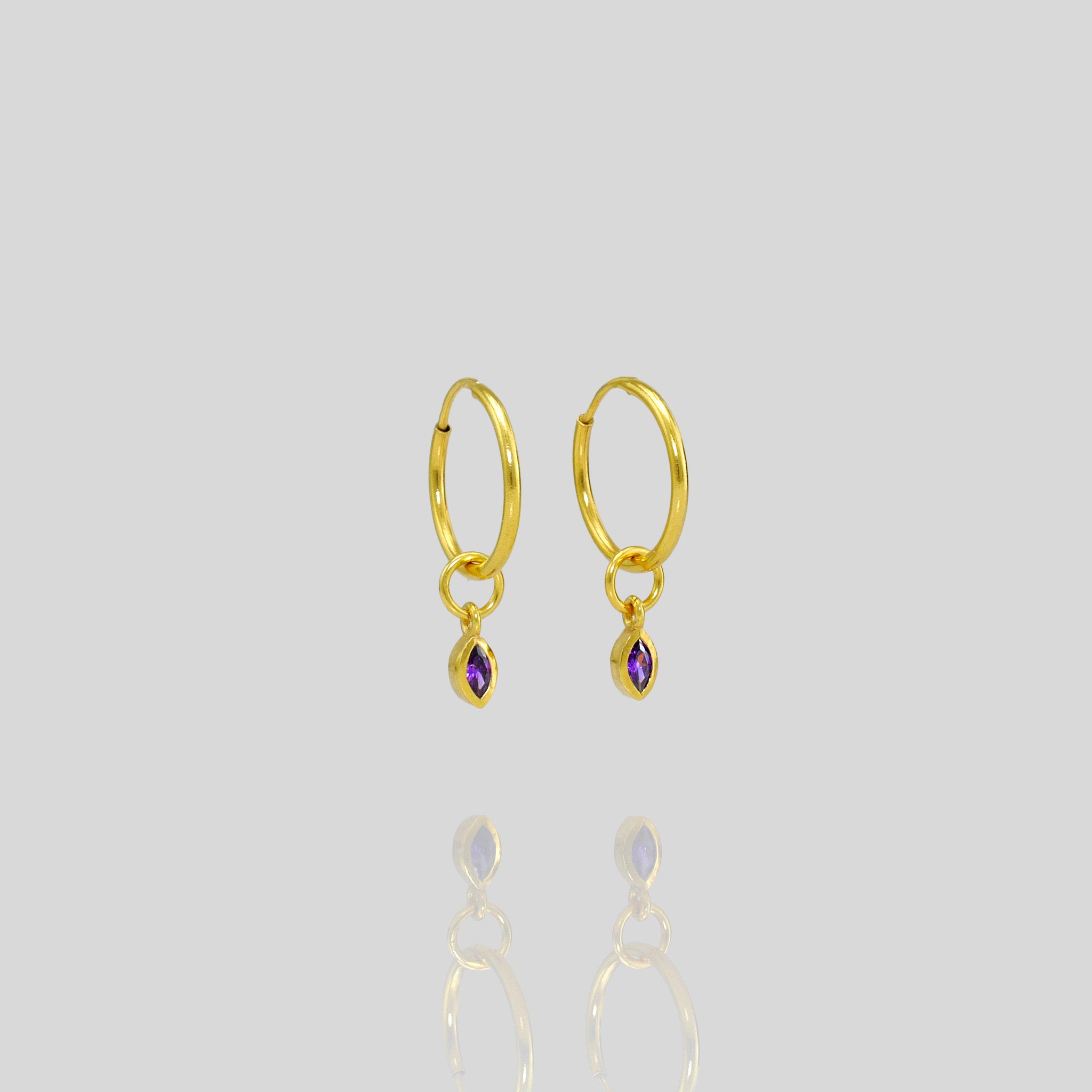 Tiny and elegant gold marquee on a hoop, featuring a sleek minimalist design with a vibrant amethyst for a sophisticated touch.