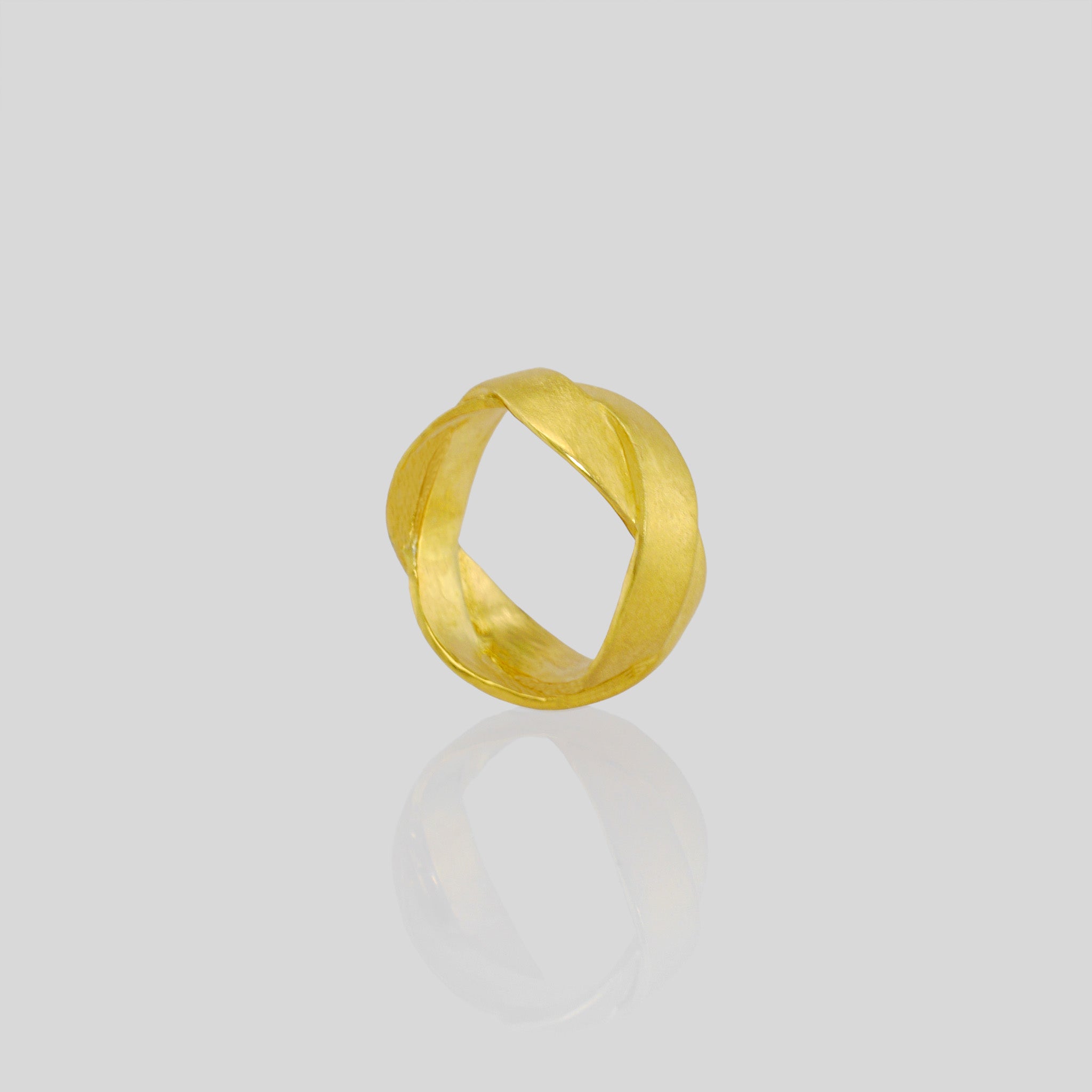 Handmade 18k Gold ring with braided bands, offering an elegant and versatile addition to both everyday wear and special occasions. A timeless classic with a unique twist.