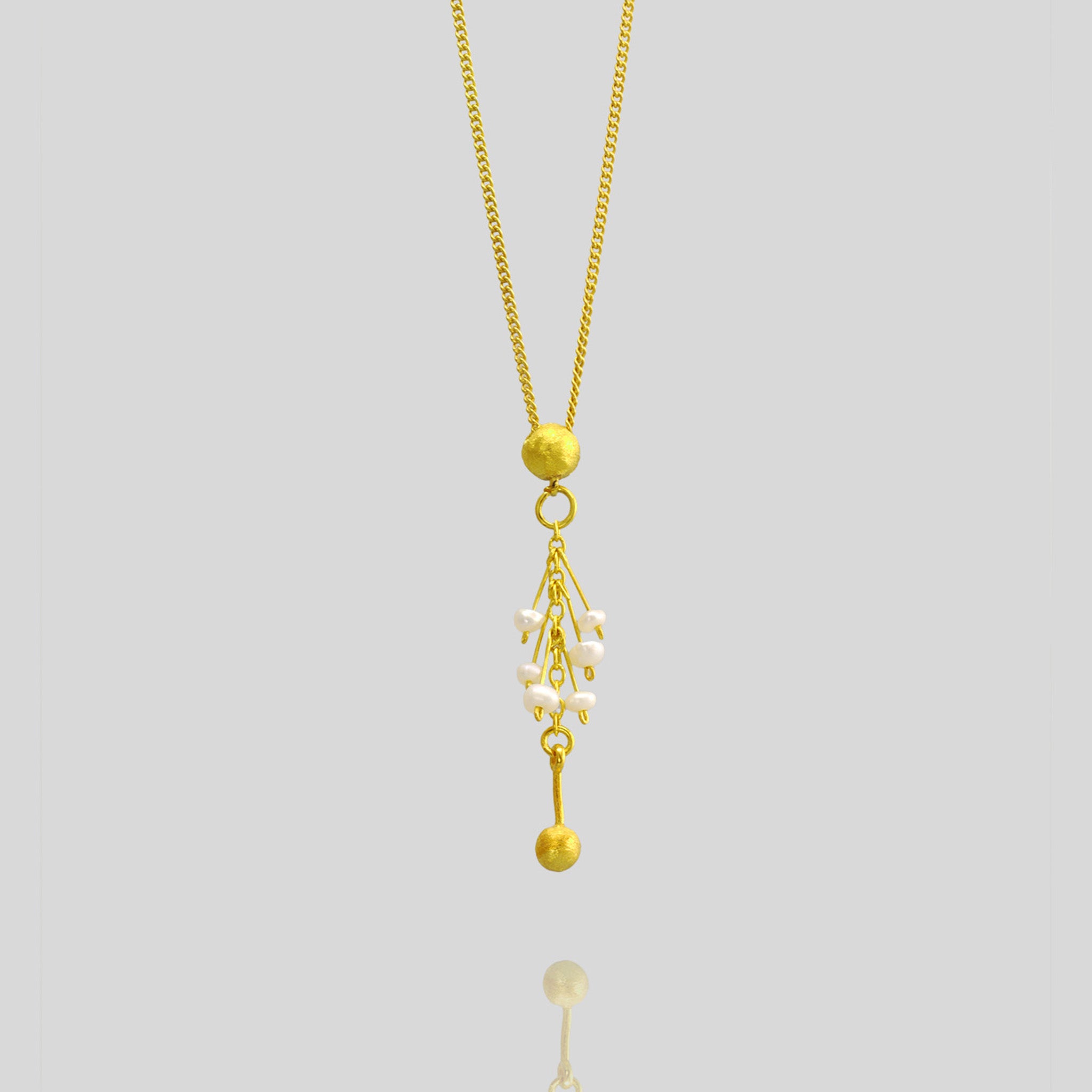 Detail of a Luxurious Venus Gold & Pearls Pendant - 18-Carat with Half Cap Design and Fine Gold Threads Adorned with Tiny Pearls.