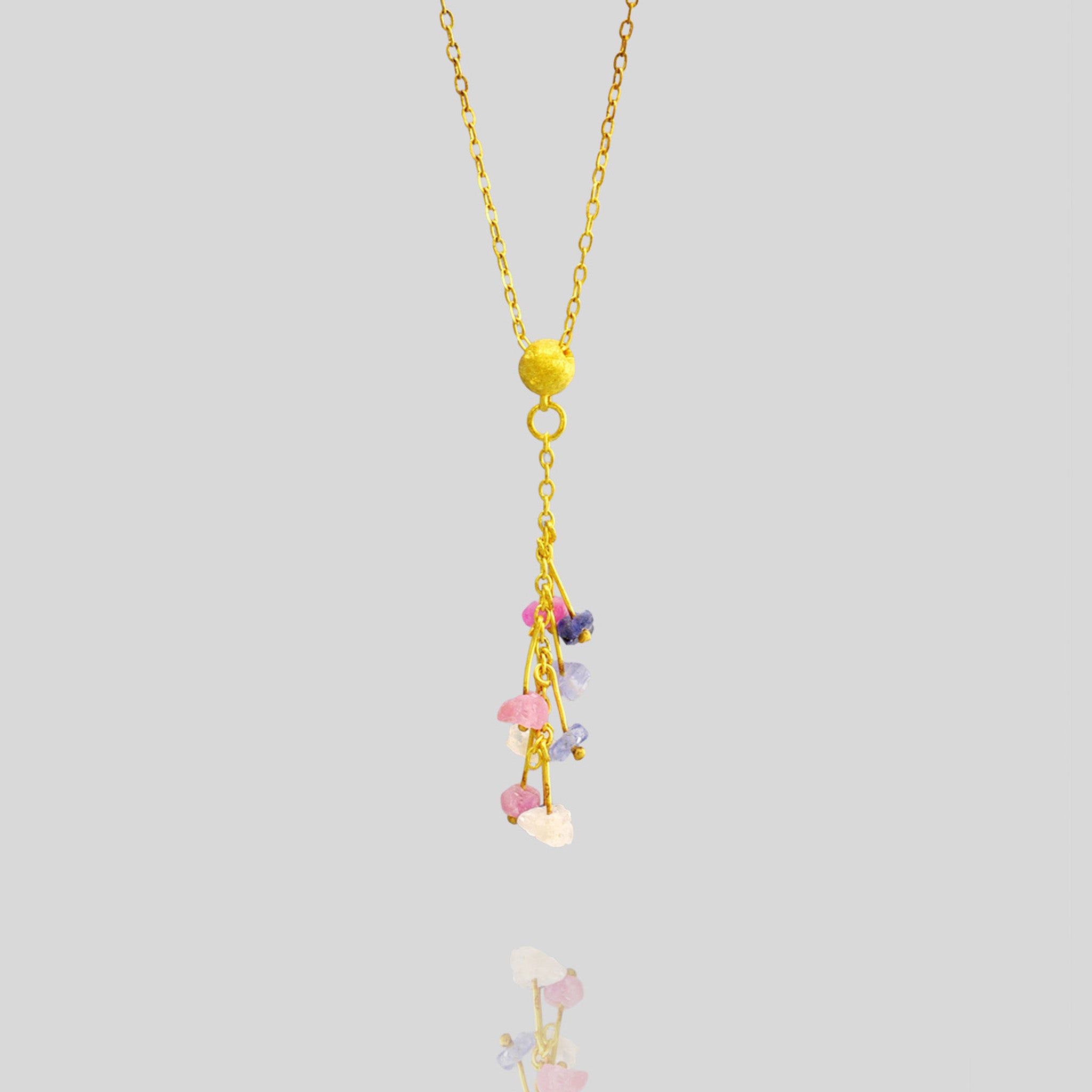 Detail of an Elegant Venus Gold Pendant with Colored Sapphires - 18-Carat Handcrafted Design with Half Cap and Fine Gold Threads.