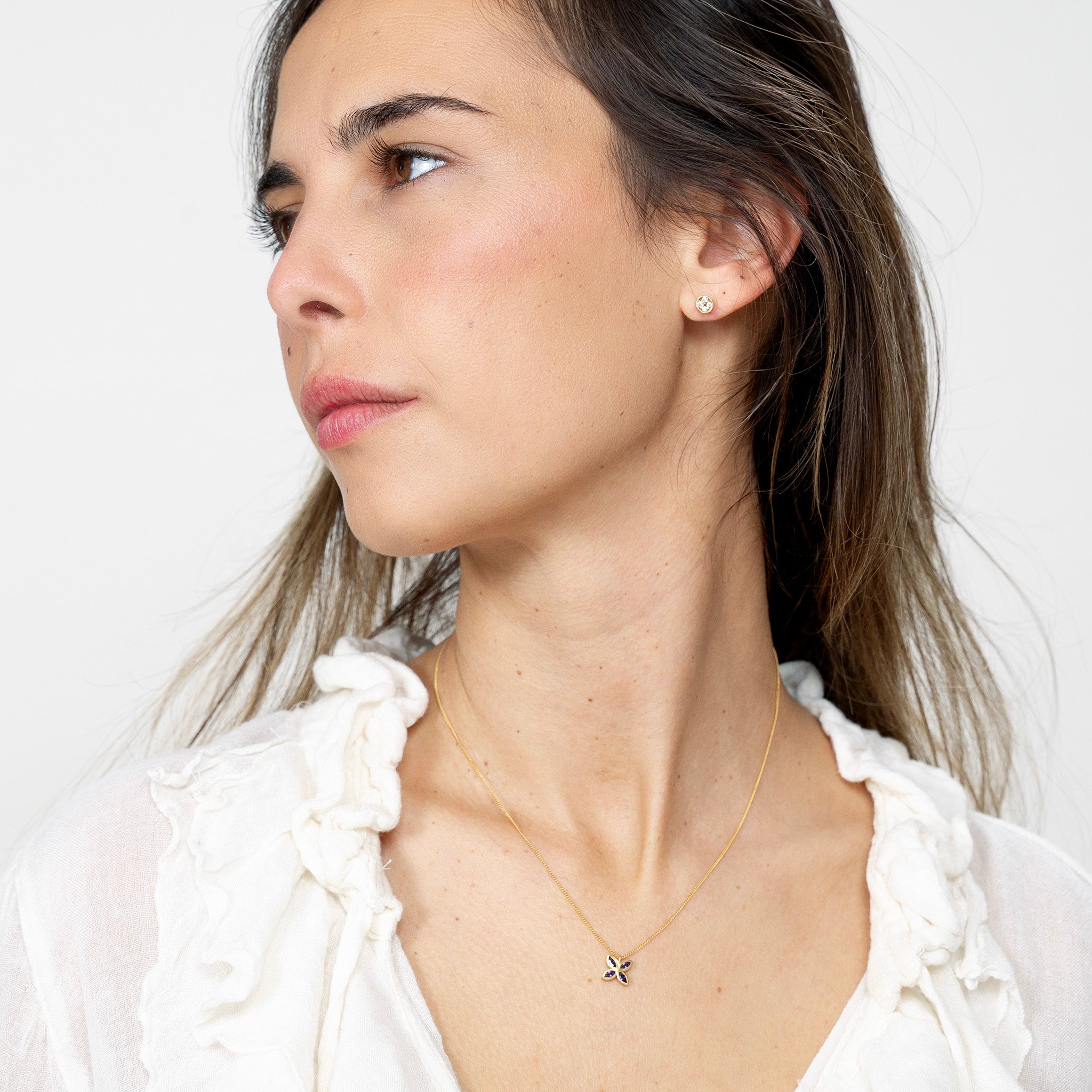 Model beautifully wearing the Gold Spring Flowers pendant, with marquise-cut Amethysts forming an intricate flower, enhancing any outfit with a luxurious touch of spring.