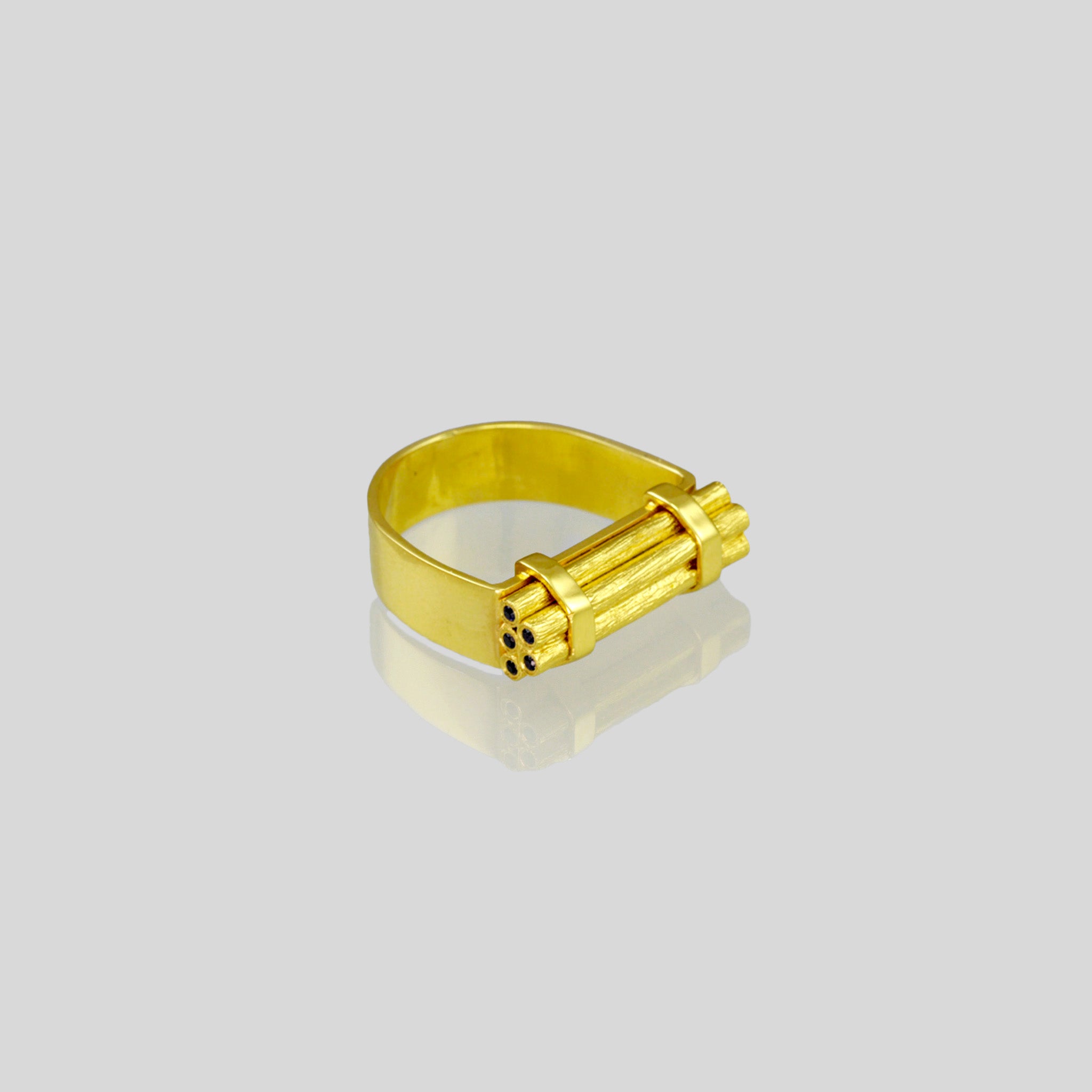 Handcrafted gold ring with stacked wood-inspired design, adorned with sparkling Sapphires for added color and radiance. Contemporary and comfortable statement piece.