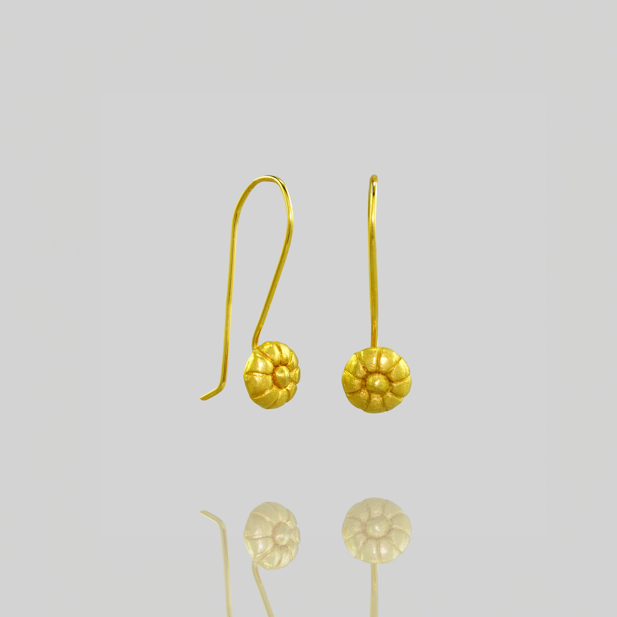Close up of Mallow Fruit-inspired Gold Drop Earrings with Delicate Beauty