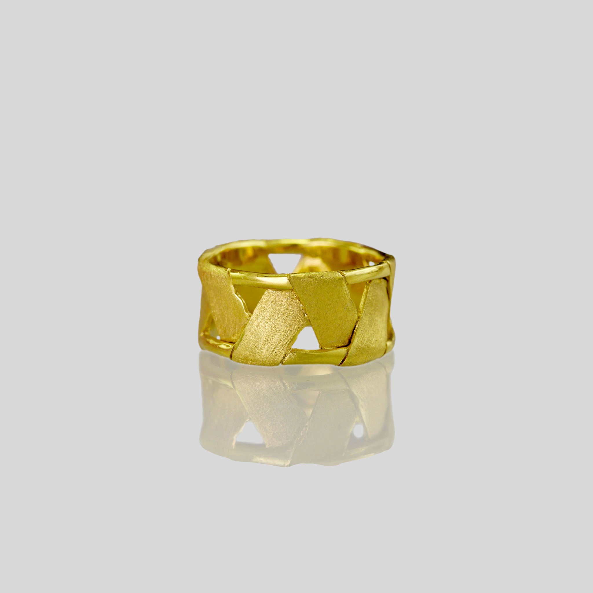Unique 18k Yellow Gold Braided Ring fashioned in the shape of a drum, offering both boldness and comfort with its lightweight design.