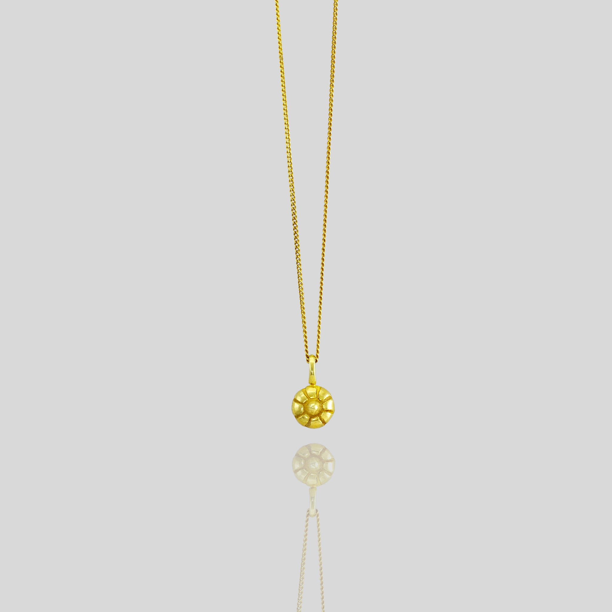 Pendant crafted to resemble the Mallow fruit, made from luxurious gold, capturing its delicate and luminous natural form.