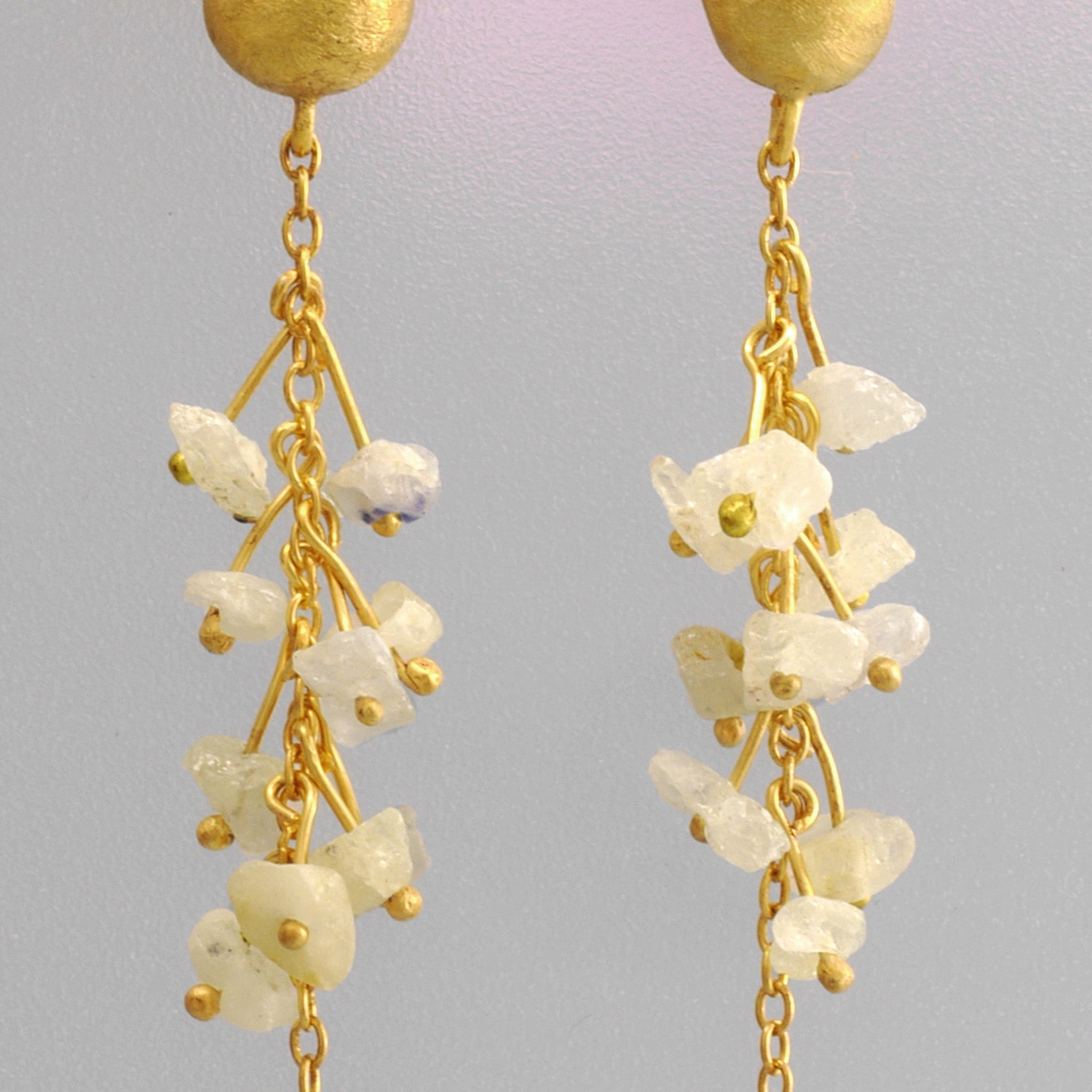 Close up of 18k Yellow Gold Venus Earrings with raw white Sapphires and a Citrine drop, crafted for versatile elegance.
