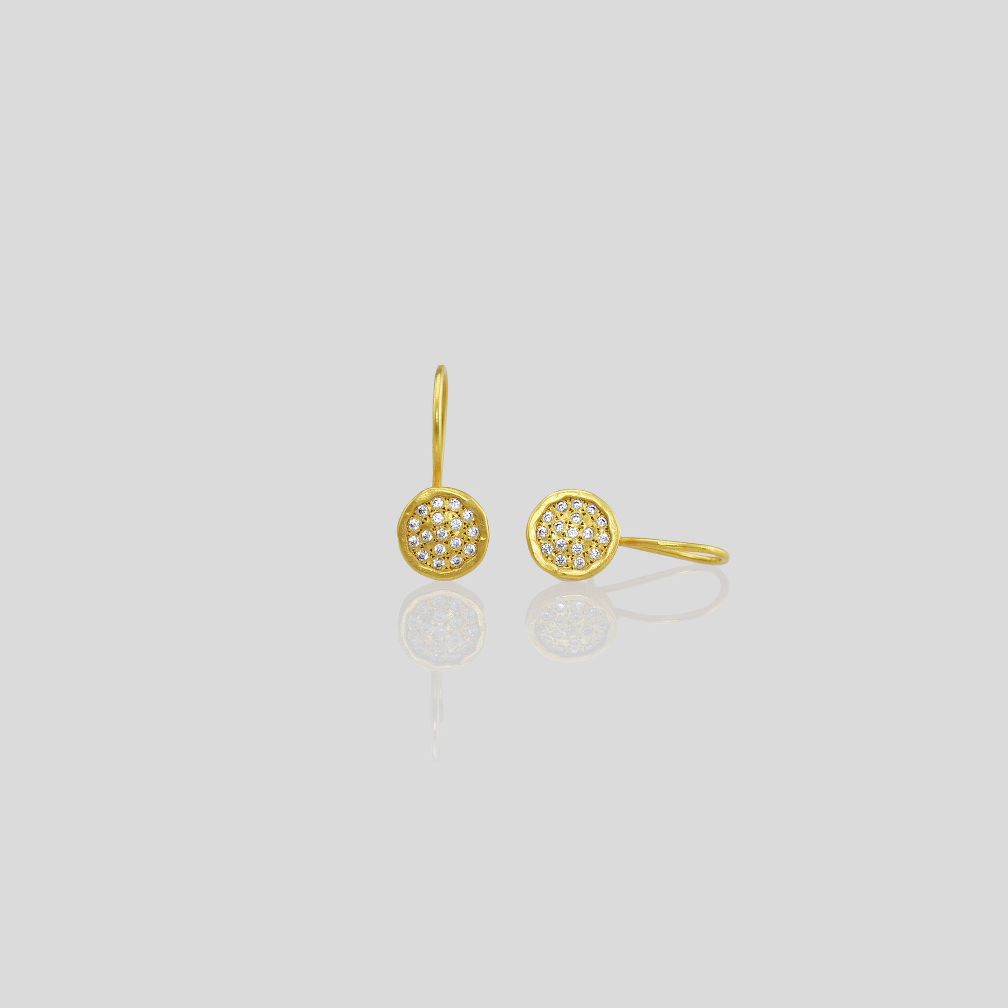 Gold drop earrings adorned with sparkling Diamonds, reminiscent of a starry night sky.