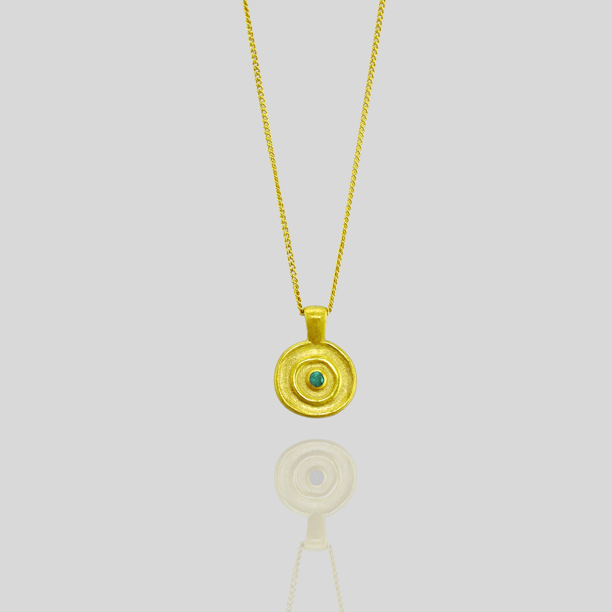 Pharaohs II - Exquisite handmade round gold pendant with a central Emerald gemstone, inspired by the timeless elegance of ancient Egyptian Pharaohs' gold jewelry, crafted from Yellow Gold.