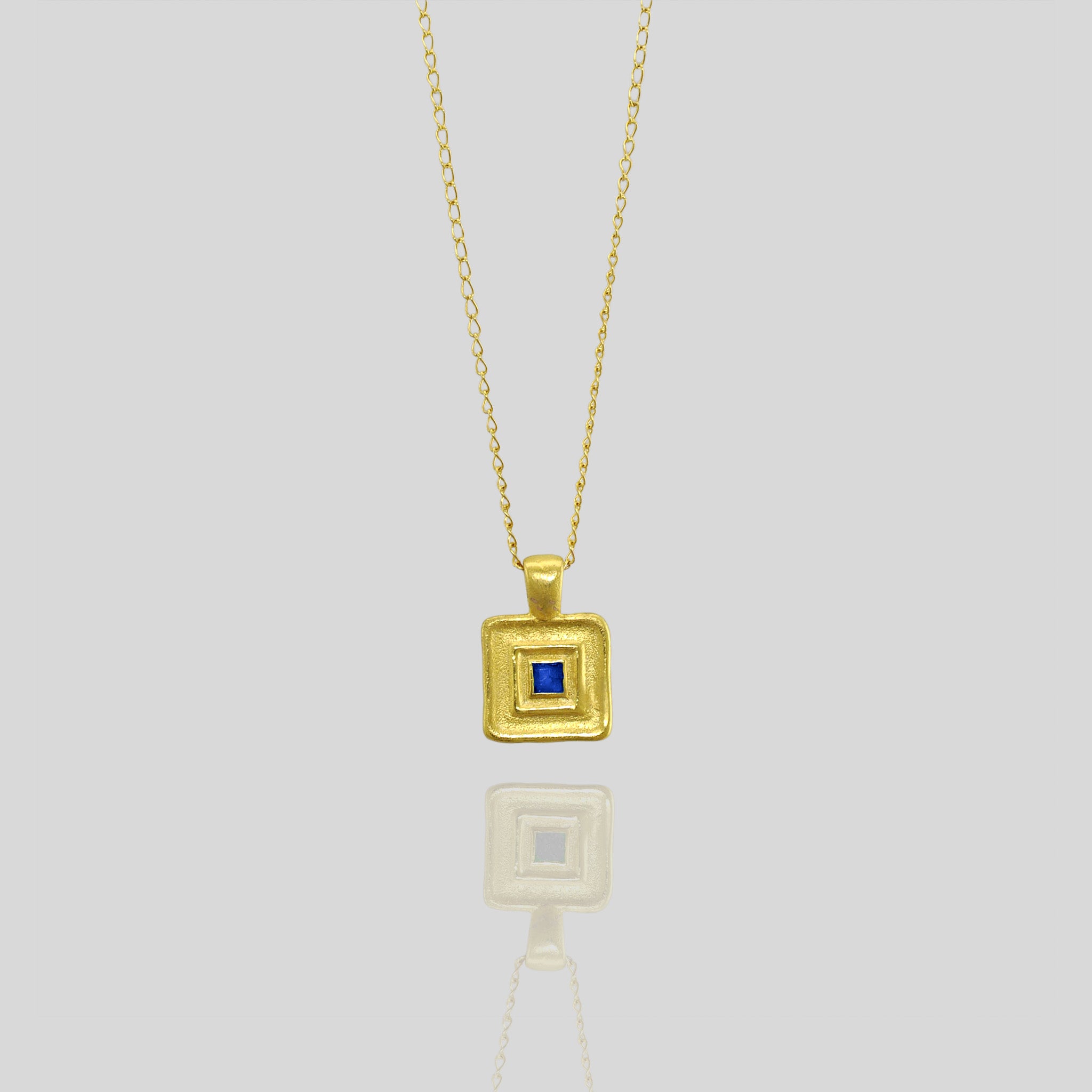 Pharaohs II - Handmade square gold pendant featuring a striking square Sapphire gemstone at its heart, crafted from Yellow Gold to mirror the majestic jewelry of ancient Egyptian Pharaohs.