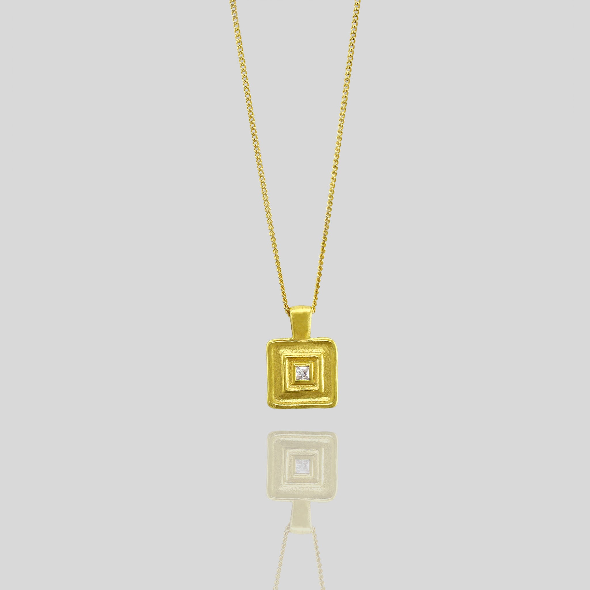 Handmade square gold pendant featuring a square diamond at its heart, crafted from Yellow Gold to mirror the majestic jewelry of ancient Egyptian Pharaohs.