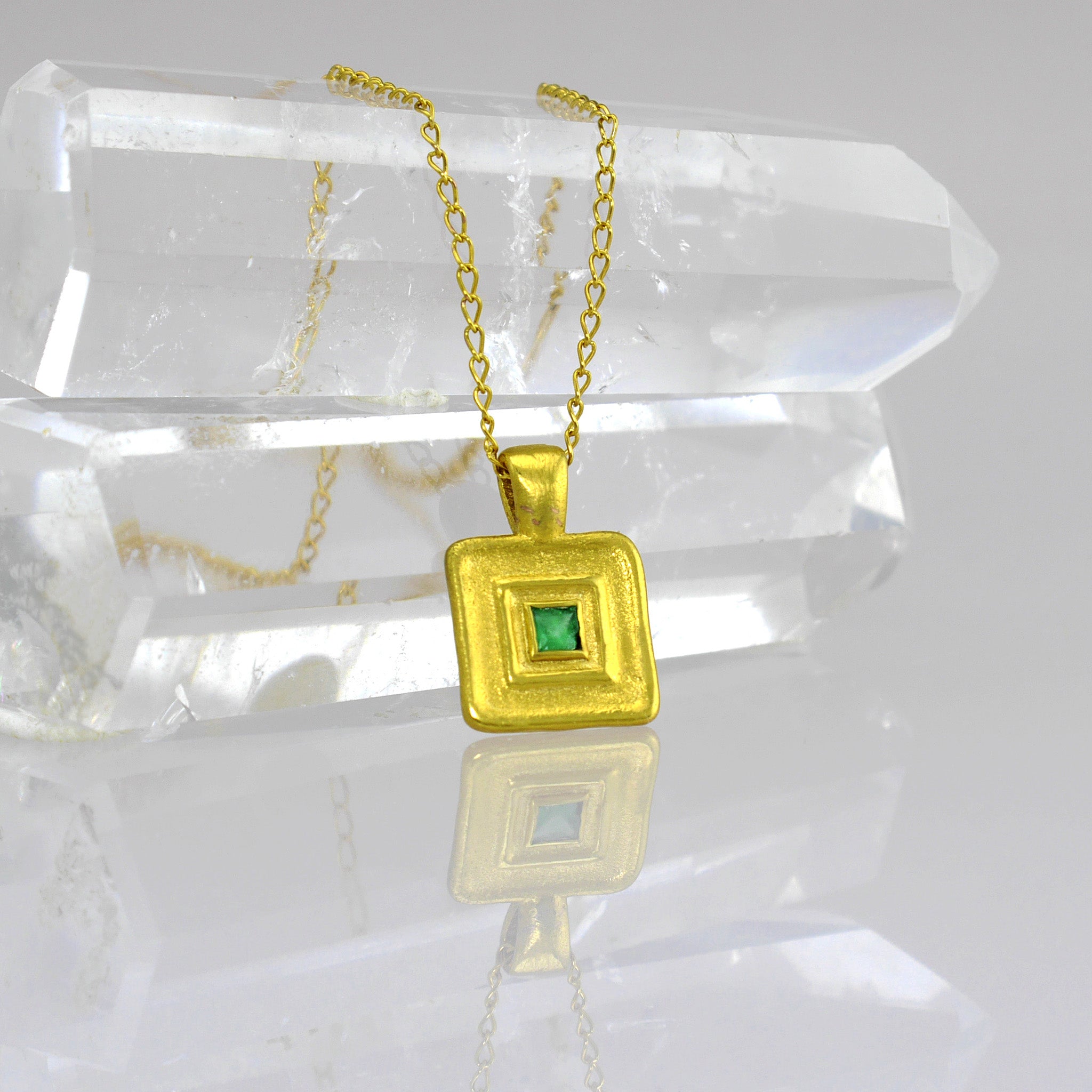 Detail of Pharaohs II - Handmade square gold pendant featuring a striking square Emerald gemstone at its heart, crafted from Yellow Gold to mirror the majestic jewelry of ancient Egyptian Pharaohs.