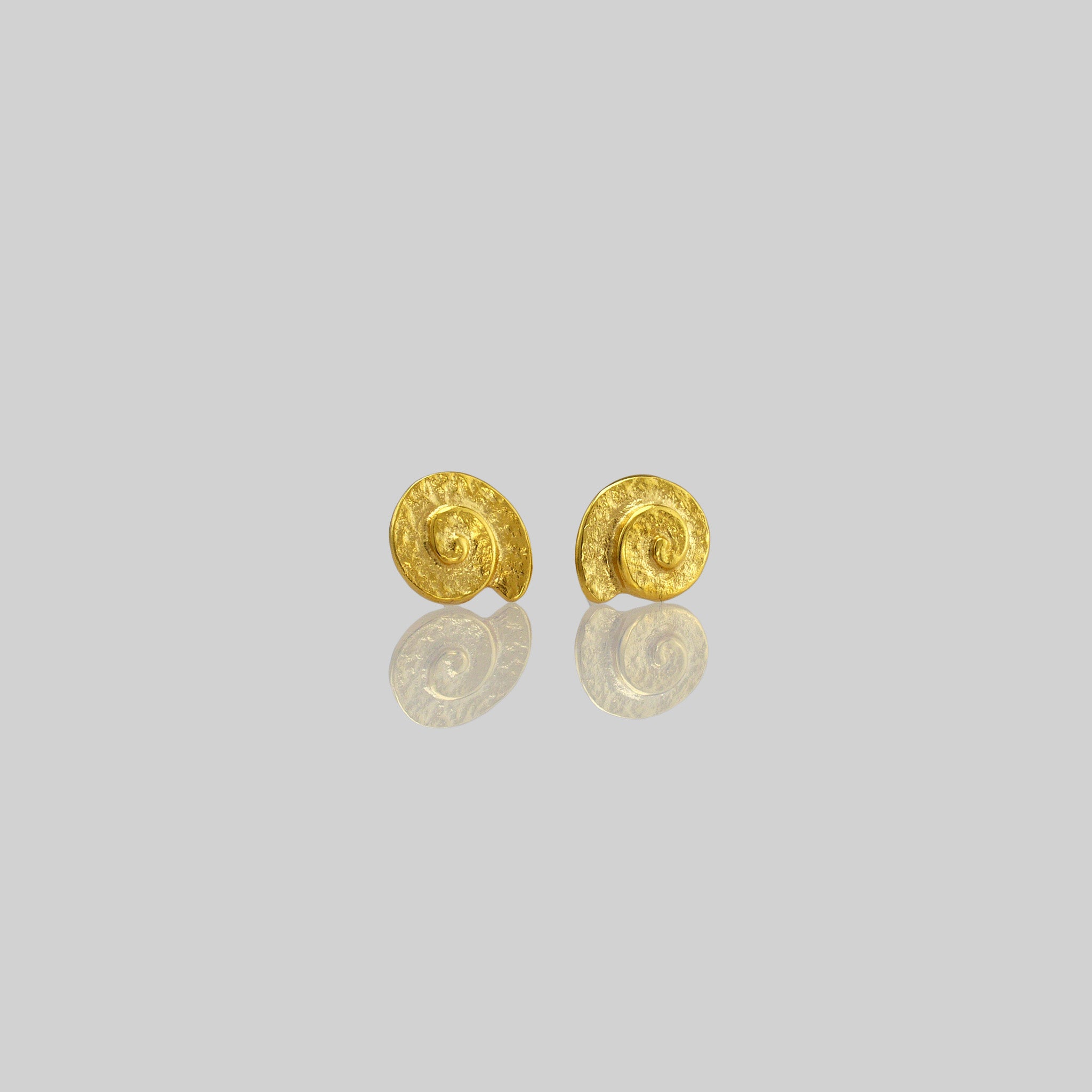 Classic and elegant yellow gold stud earrings with a textured arched spiral.