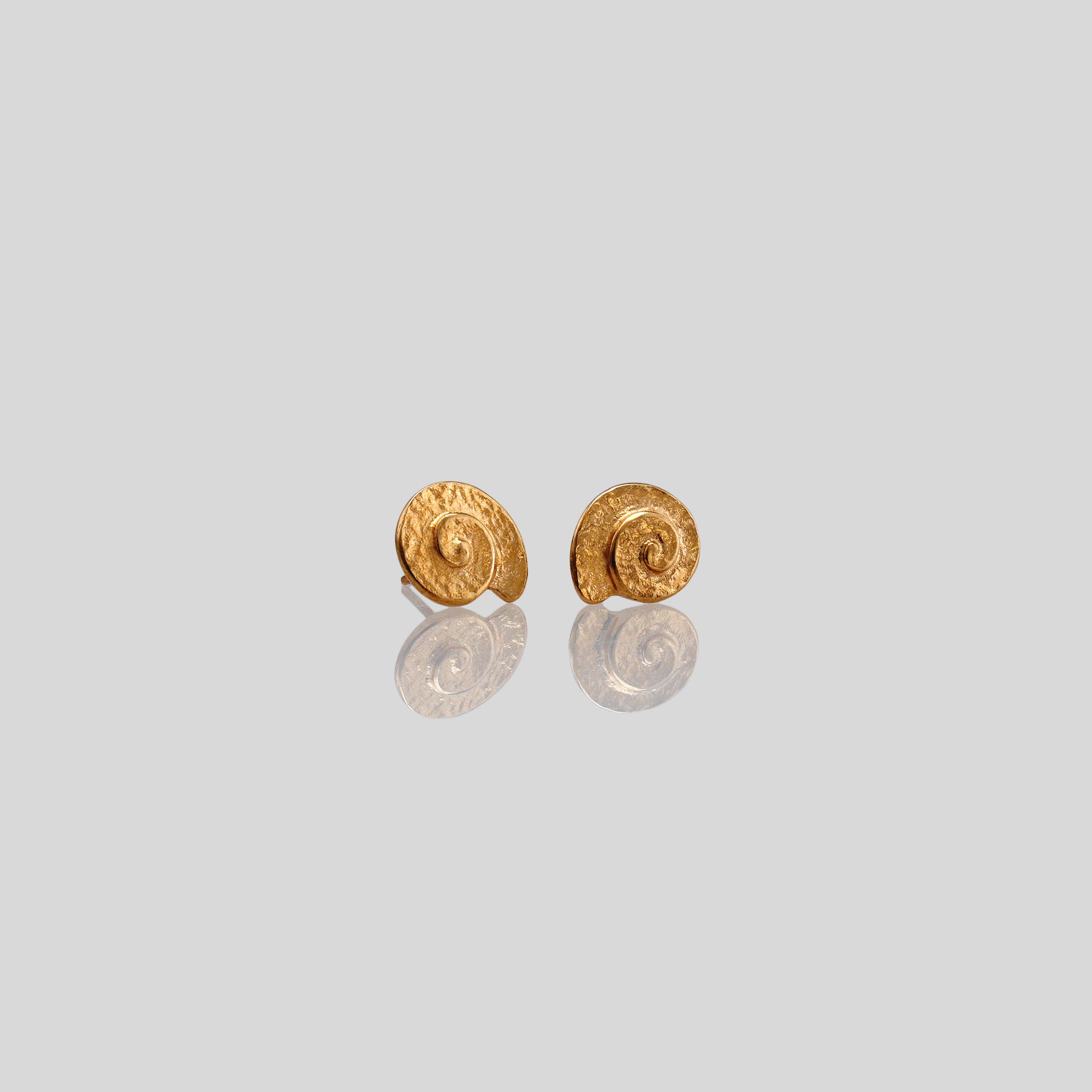 Classic and elegant Rose gold stud earrings with a textured arched spiral.