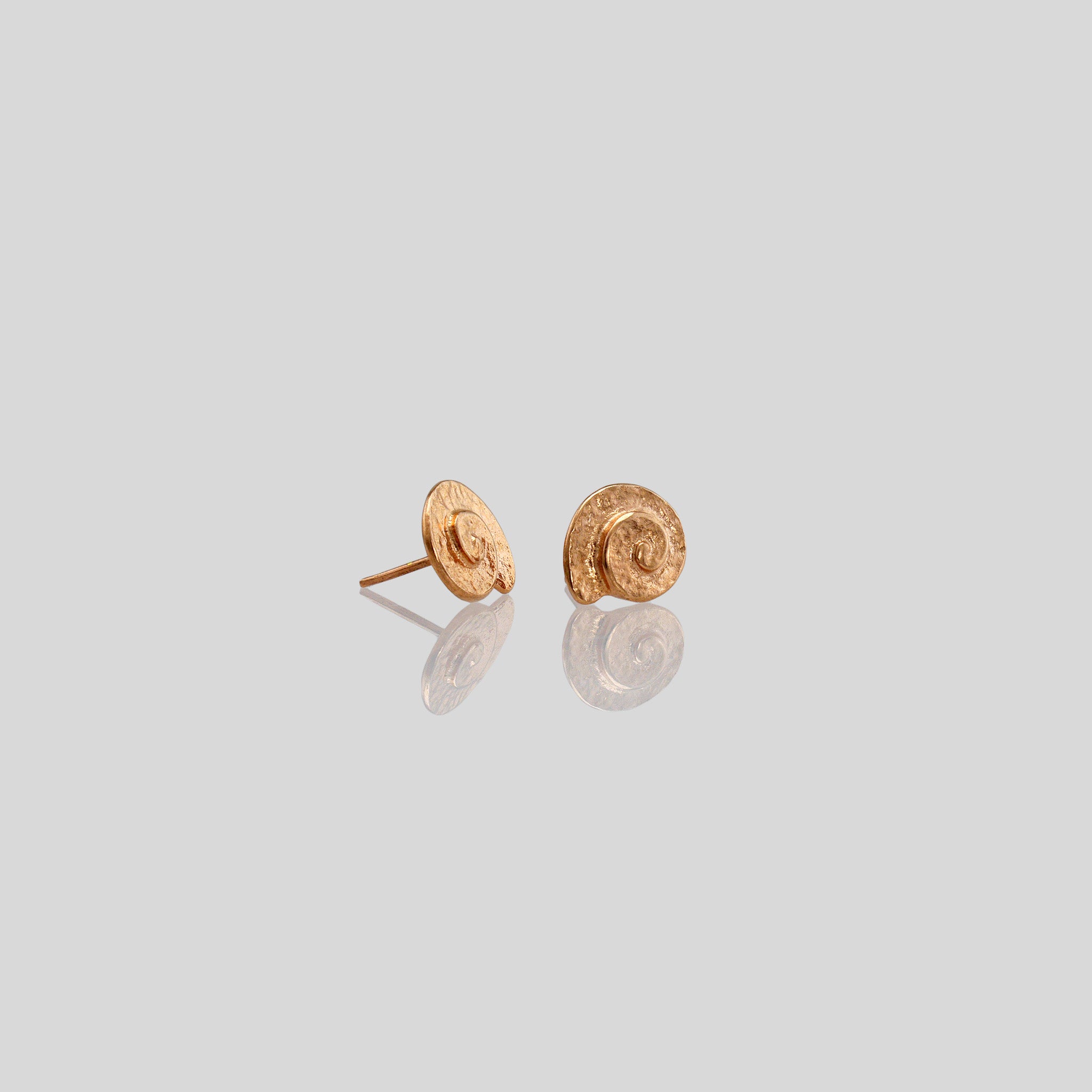 Classic and elegant Rose gold stud earrings with a textured arched spiral.