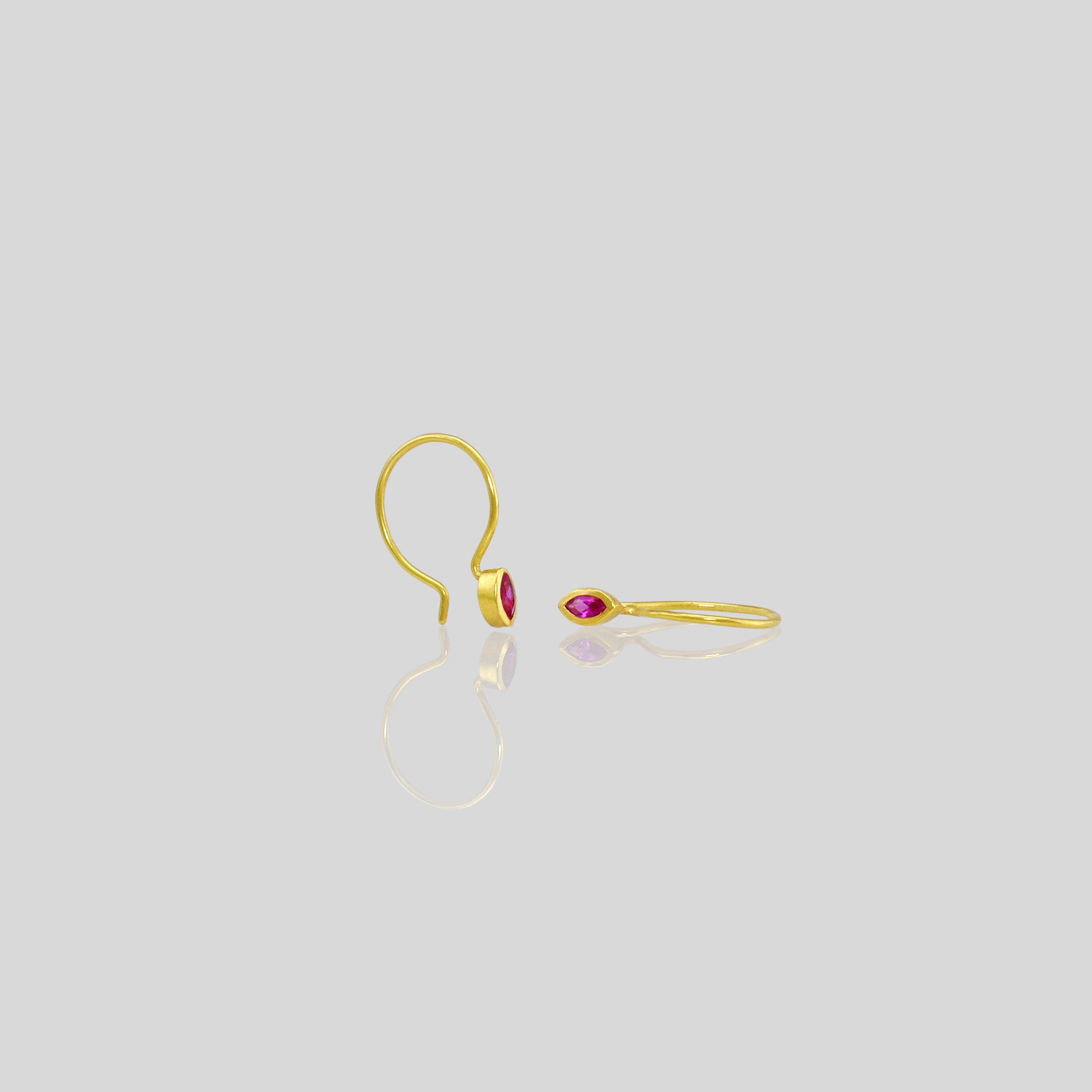 Tiny Ruby Marquee earrings on playful gold hoops. Elegant and eye-catching!