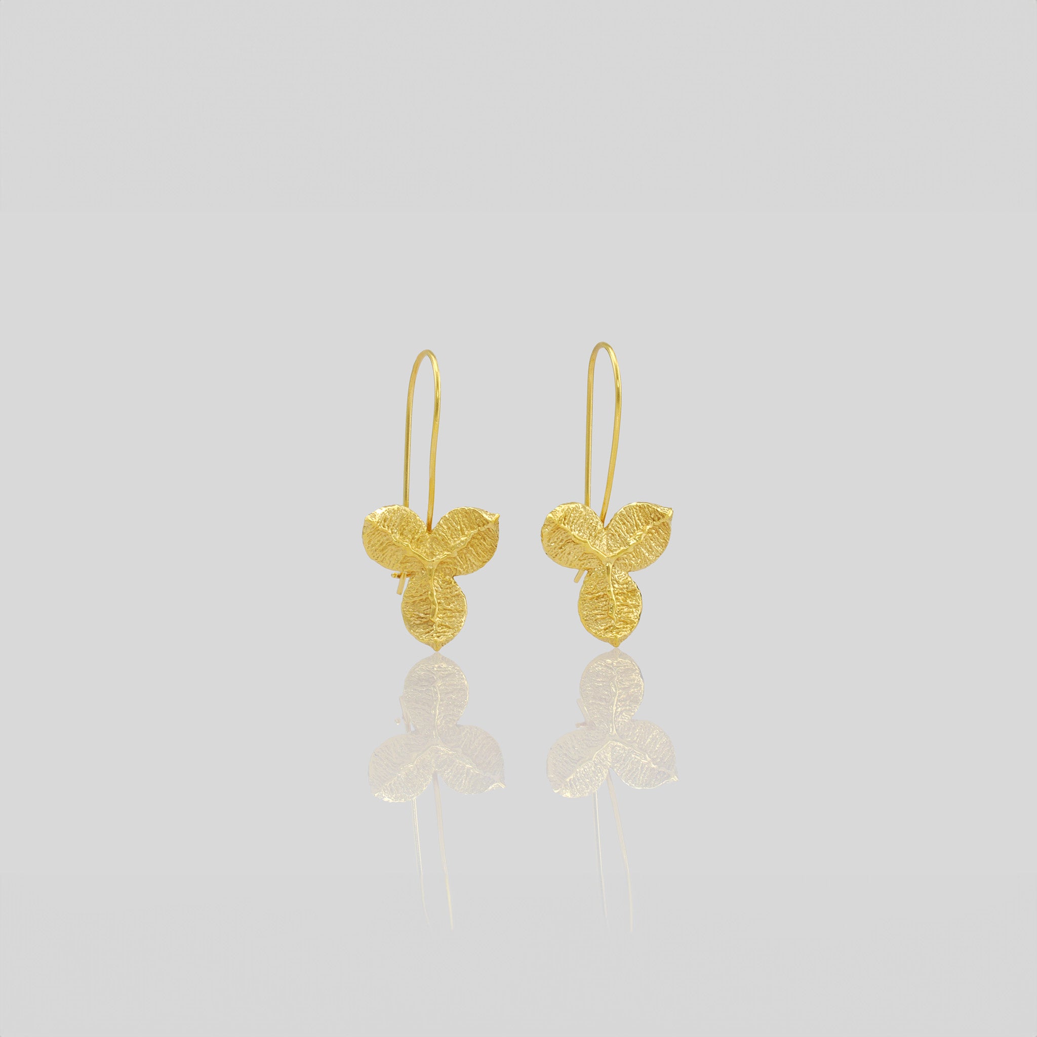 Nature-inspired Yellow Gold Drop Earrings with Unique Textured Design.
