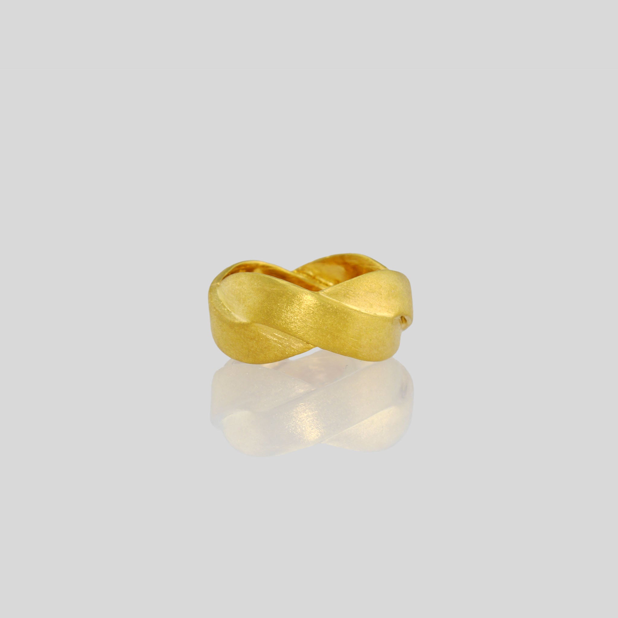 Handmade 18k Gold ring with braided bands, offering an elegant and versatile addition to both everyday wear and special occasions. A timeless classic with a unique twist.
