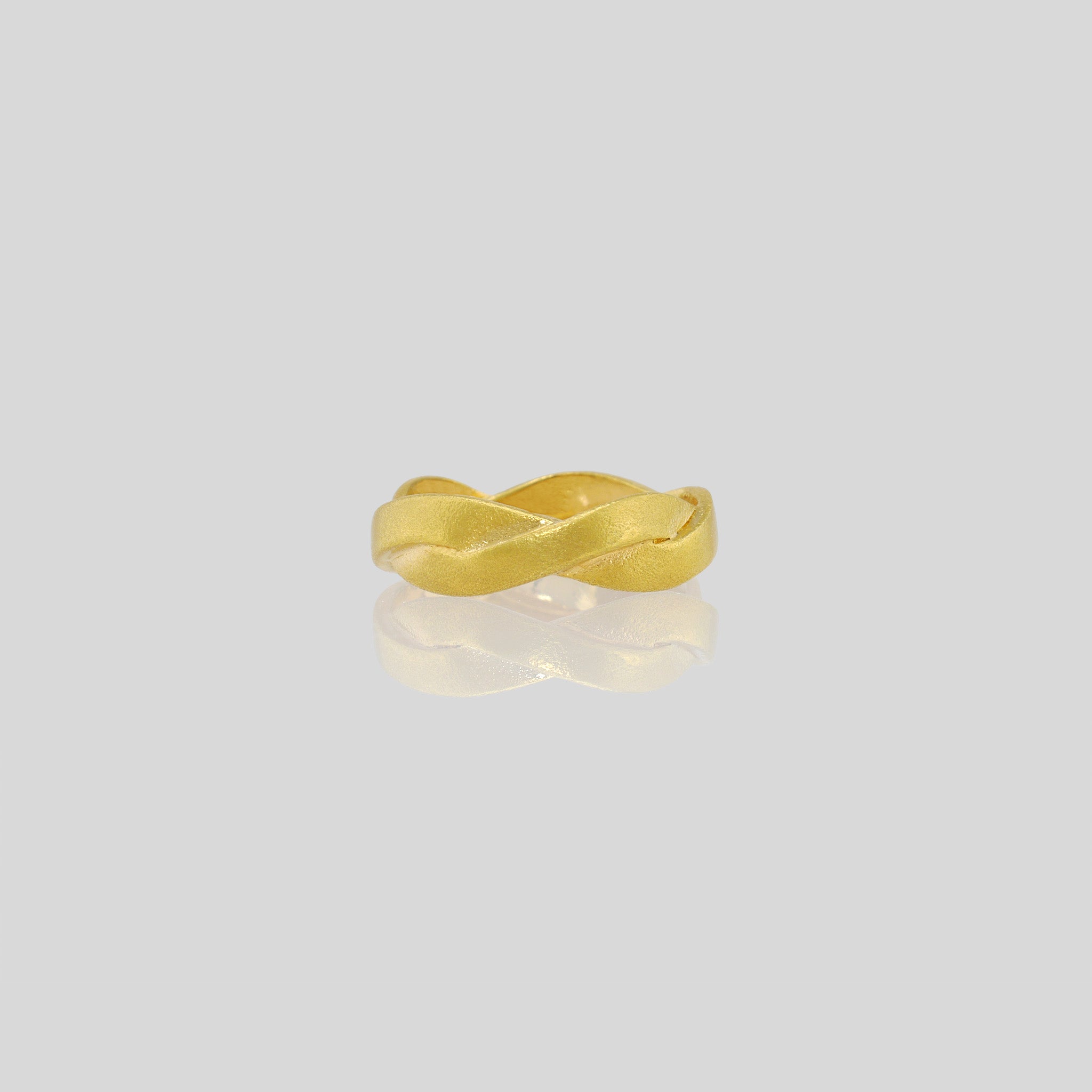 Hand-crafted ring made from Yellow Gold braids, offering an elegant and timeless touch to any attire. Intricately designed with subtle sophistication