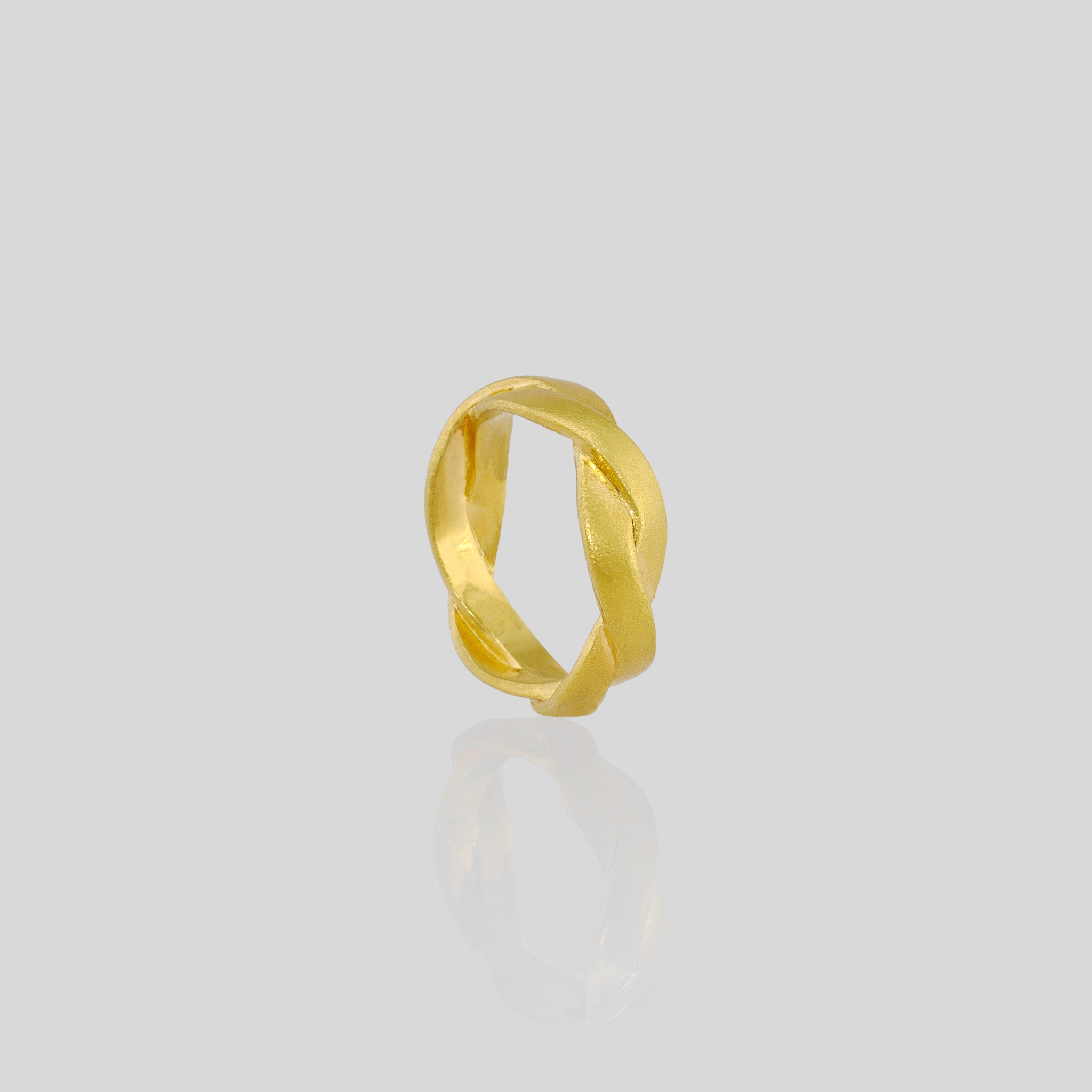 Hand-crafted ring made from Yellow Gold braids, offering an elegant and timeless touch to any attire. Intricately designed with subtle sophistication