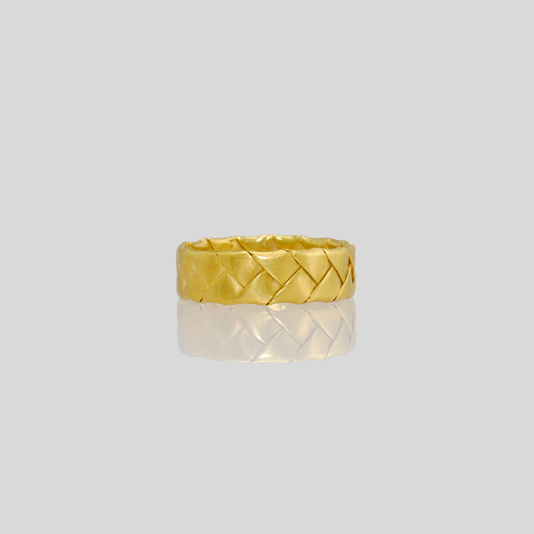 Gold Braid Ring crafted from intertwined gold strands, meticulously modeled using a unique paper processing technique. Clean, precise, and versatile, suitable for daily wear.
