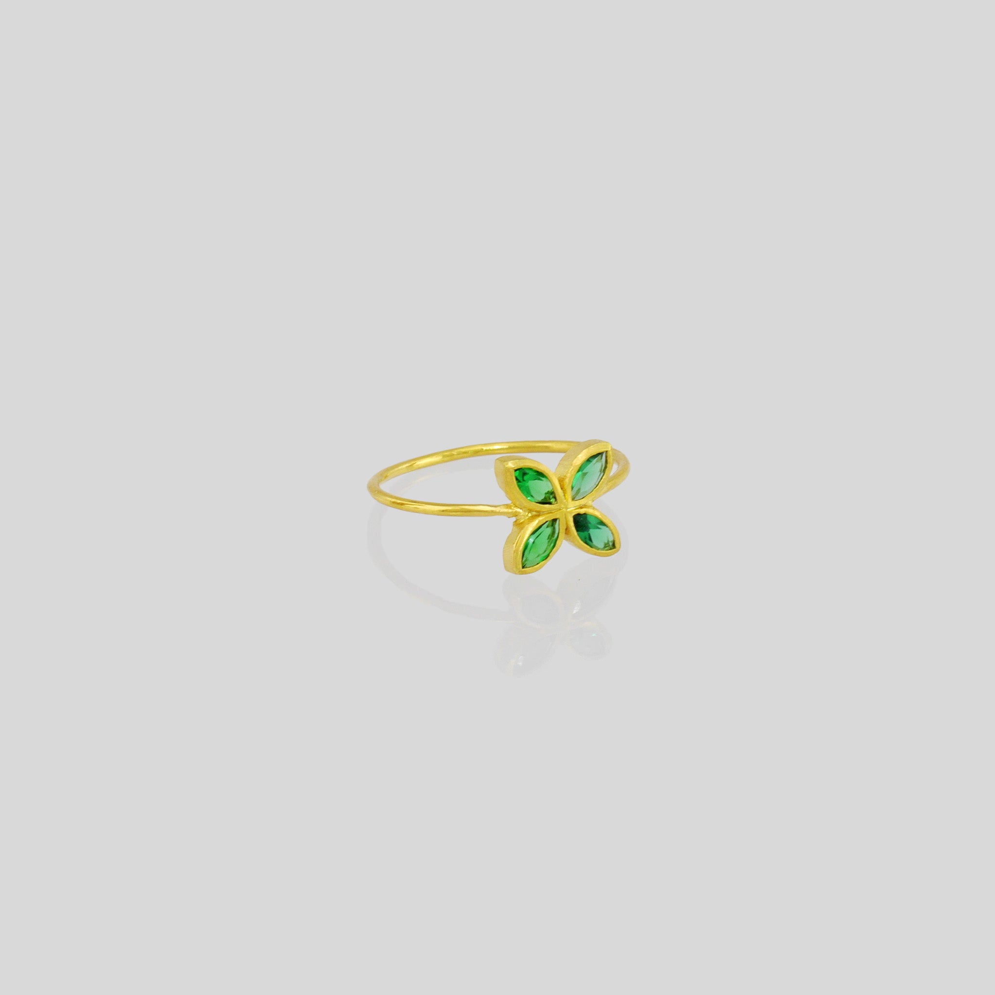 Delicate Gold ring with Emerald marquise in a flower-shaped design. Radiant and cheerful addition to any collection.