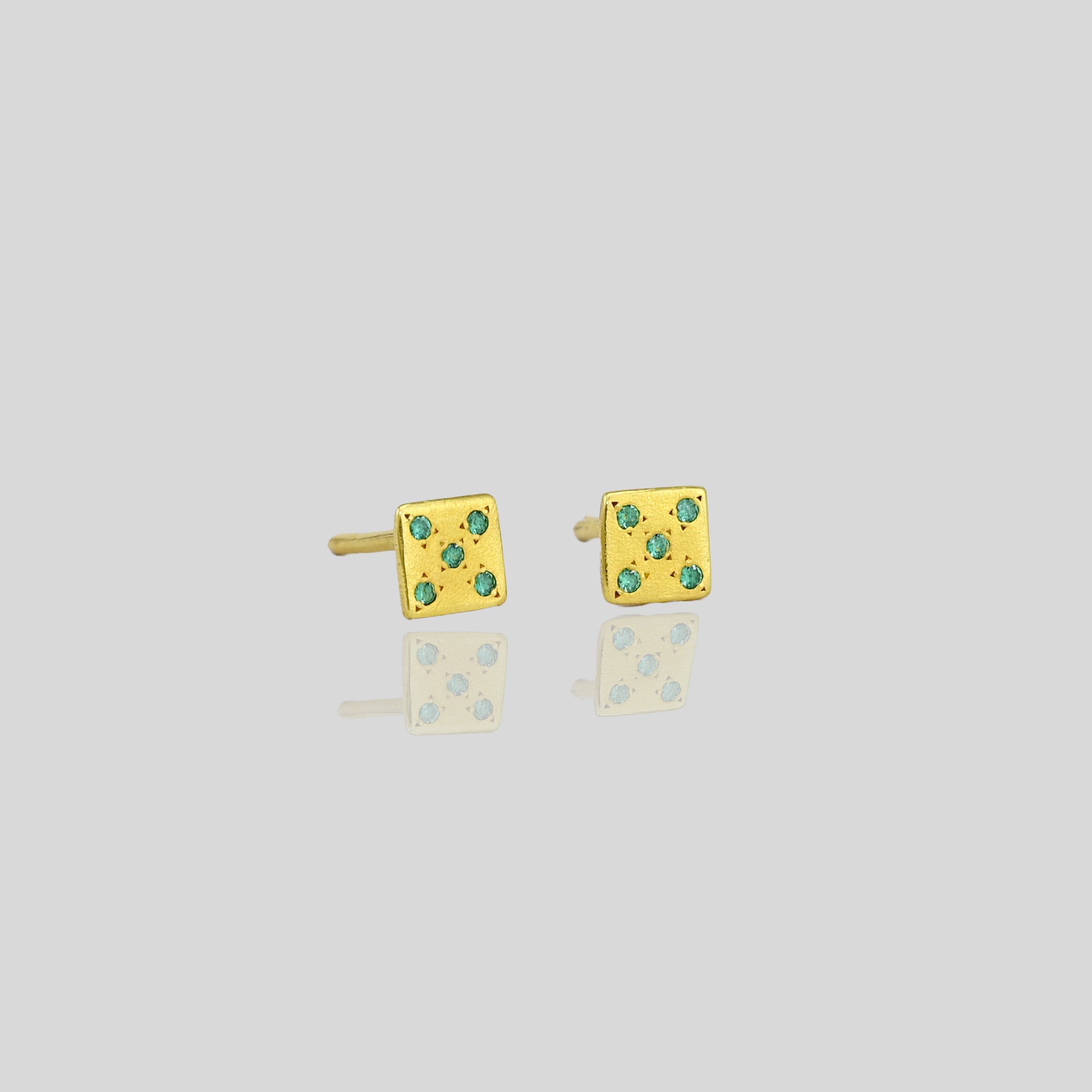 Close up of Lucky Charm Emerald Gold Stud Earrings with Playful Dice Pattern