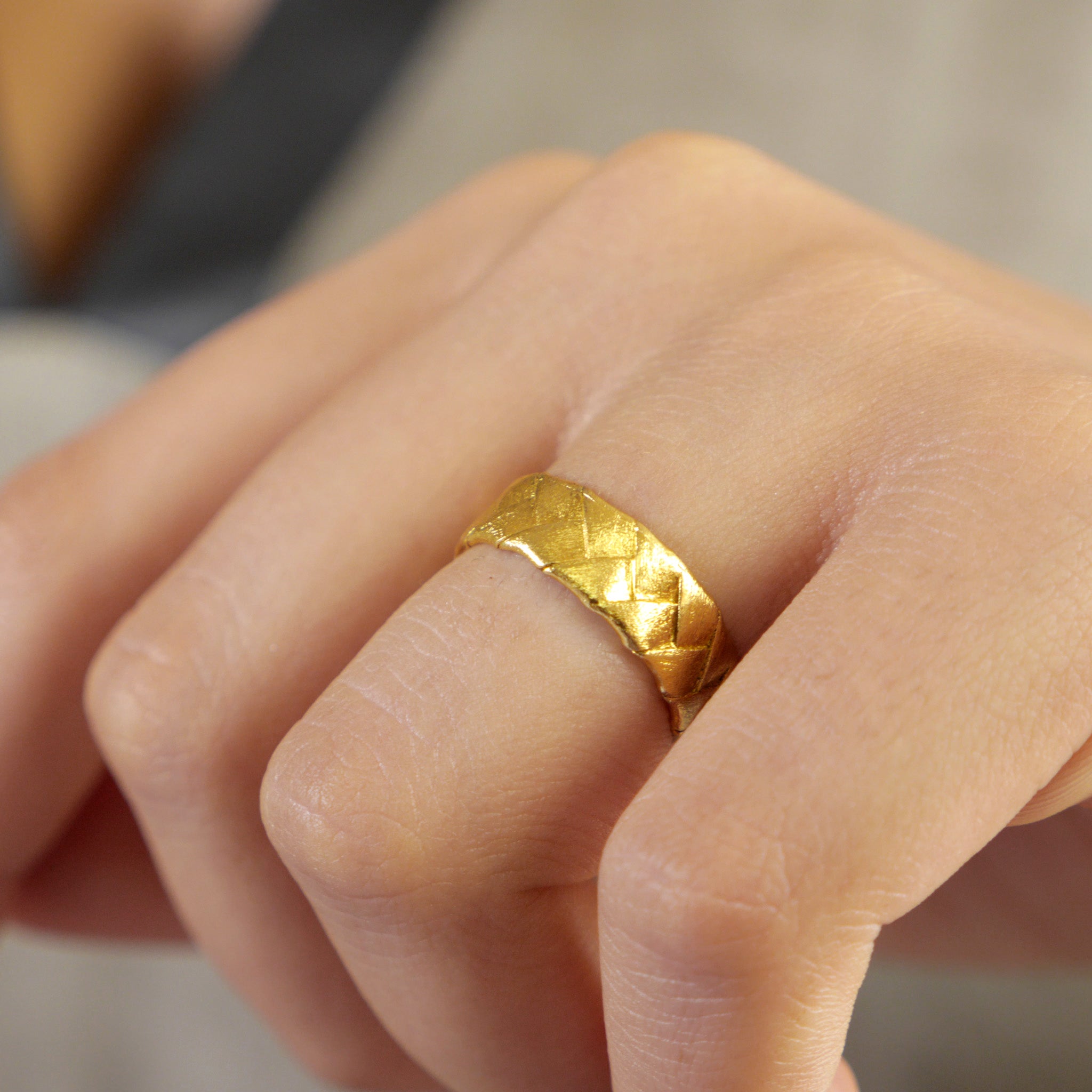 Model showcasing the Classic Yellow Gold Braid Ring, highlighting its intricate braiding and everyday elegance.