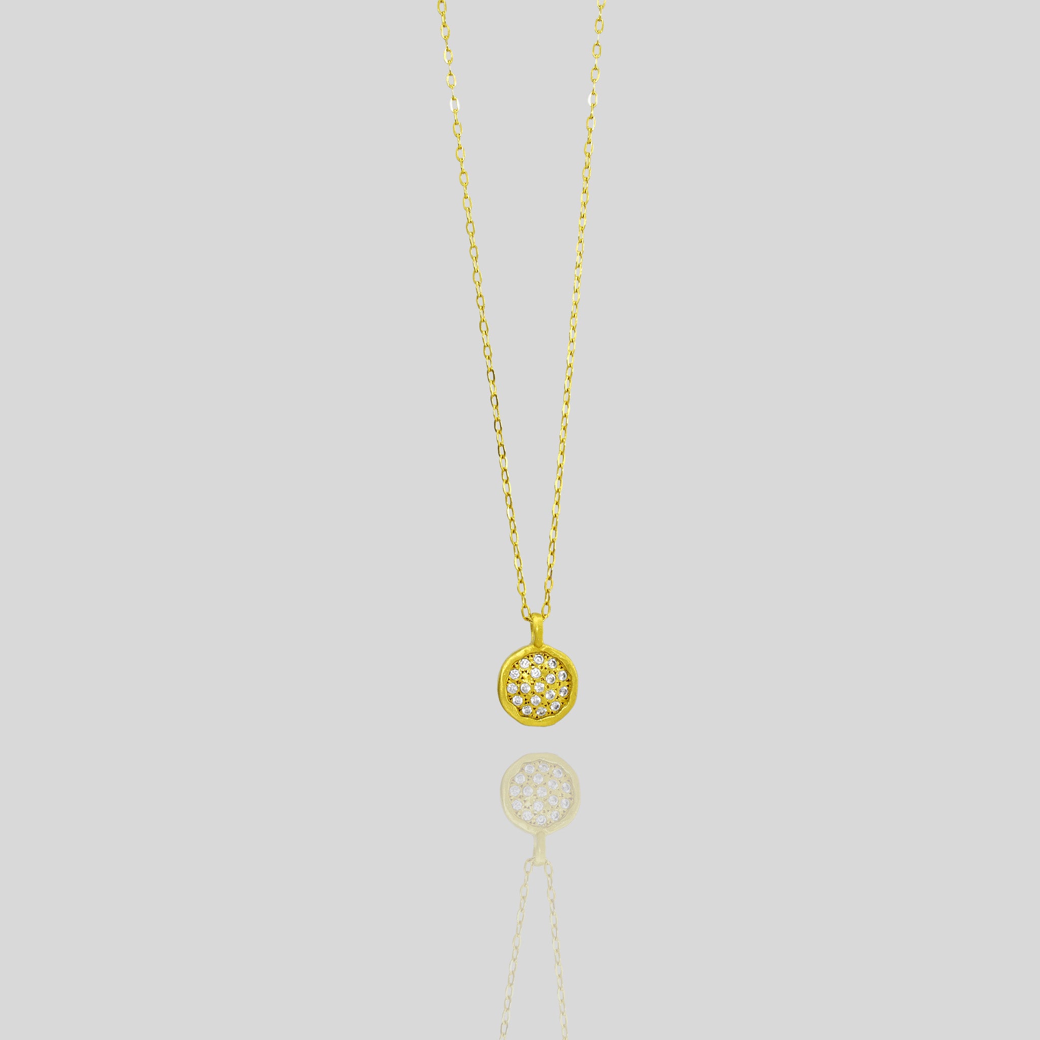 Starlit gold pendant, expertly handcrafted from Yellow Gold with a small gold plate peppered with scattered tiny Diamonds, invoking the beauty of a starry night sky.