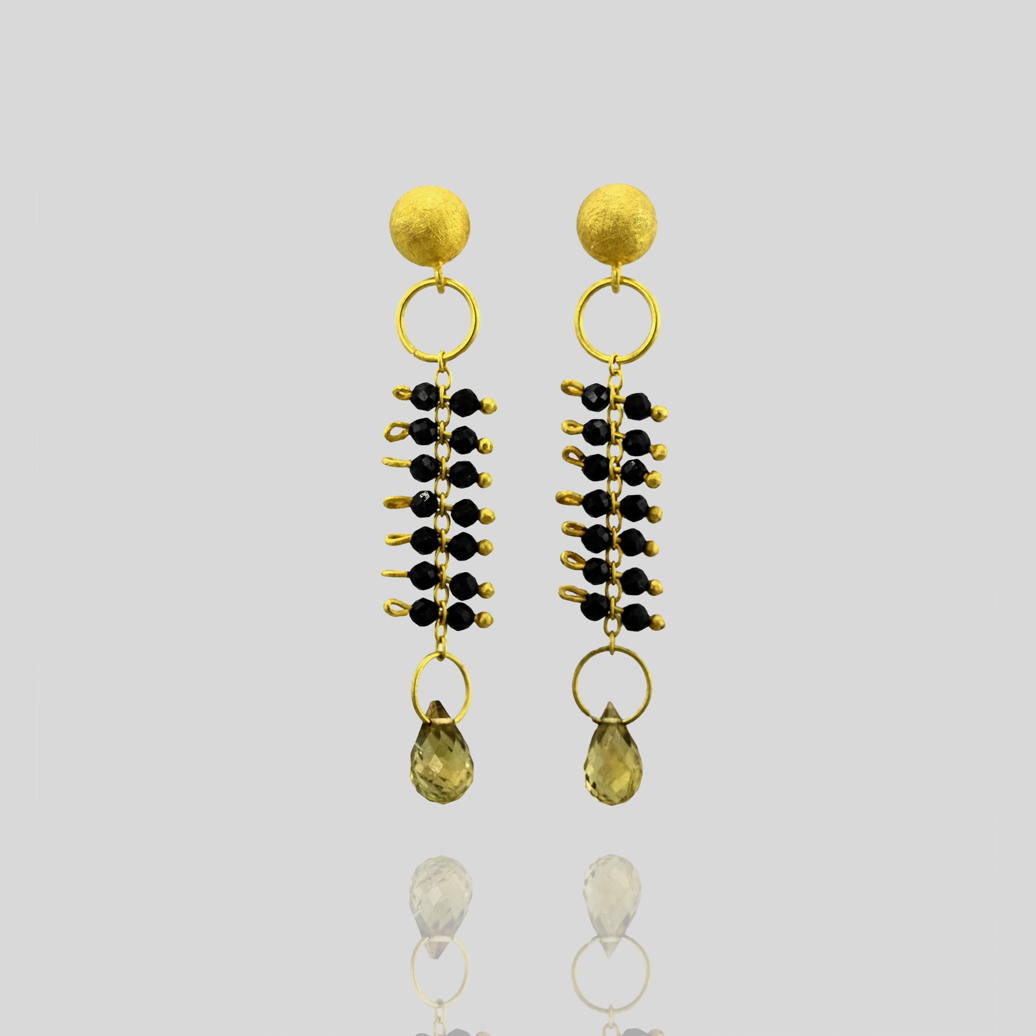 close up of Venus Gold Earrings with Onyx Beads & Drop-Shaped Tourmaline - Inspired by the Sea Goddess, with Delicate Gold Threads.