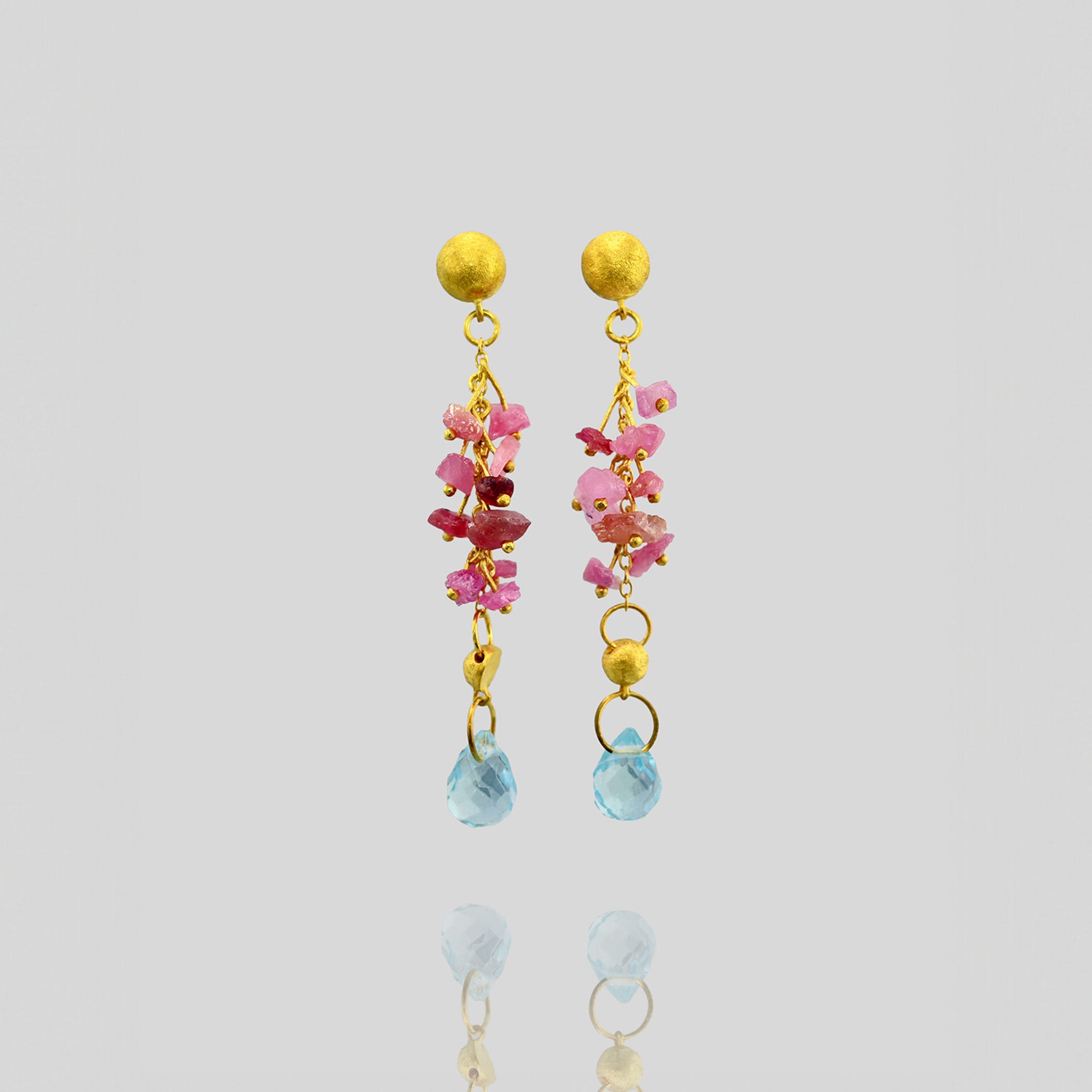 Detail of Elegant Venus Gold Earrings with Raw Pink Sapphires & Blue Topaz Drop - Unique Half Cap and Fine Gold Threads Design.